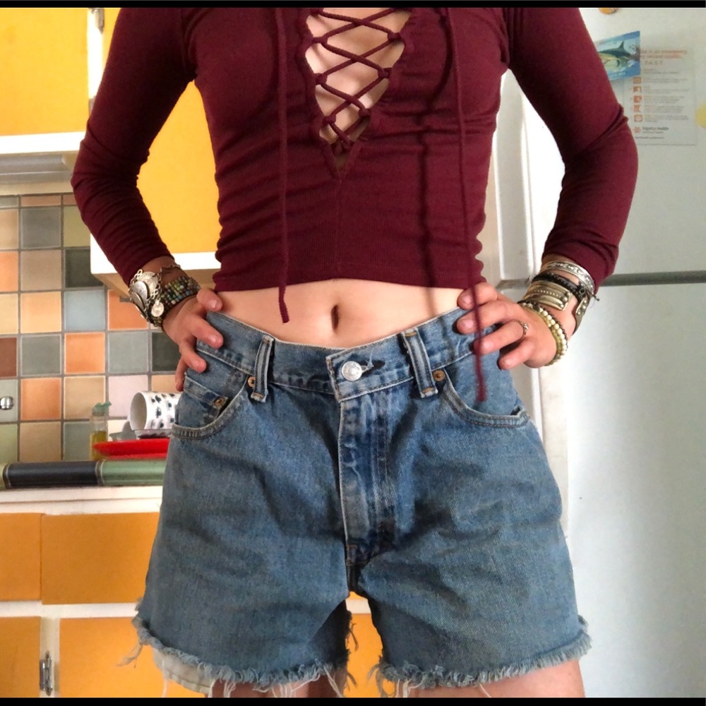 Vintage Levi 550 jean shorts worn in high waisted